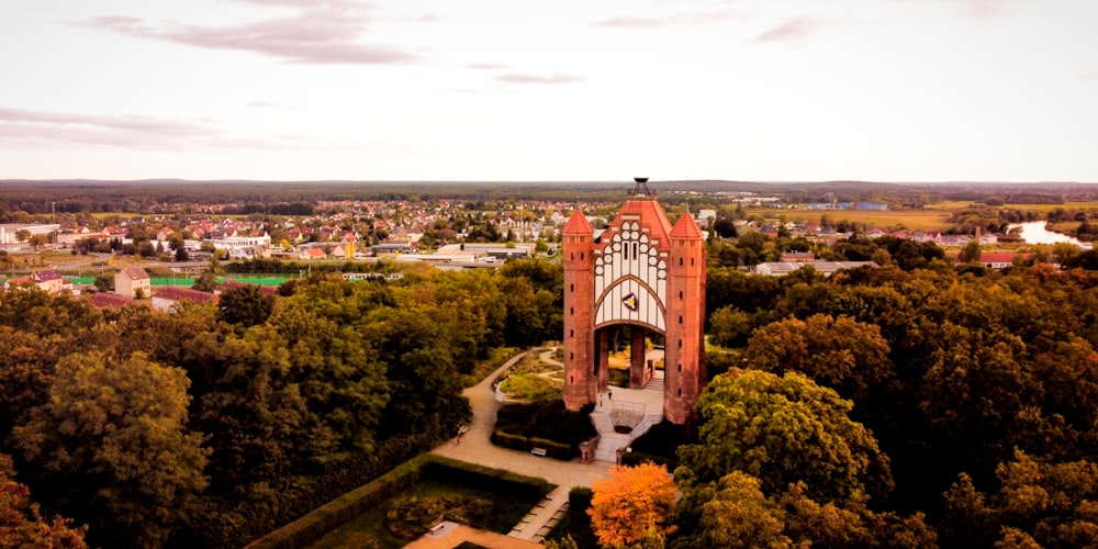 an aerial view of a building surrounded by trees