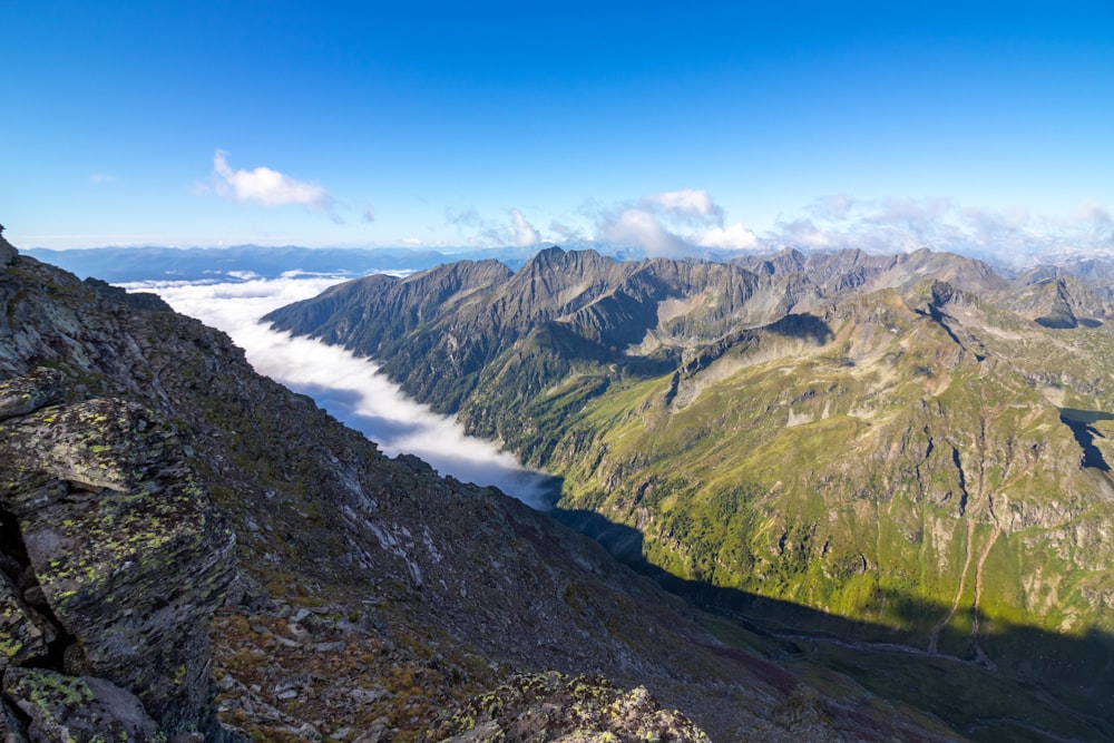 the view from the top of a mountain looking down on the valley below