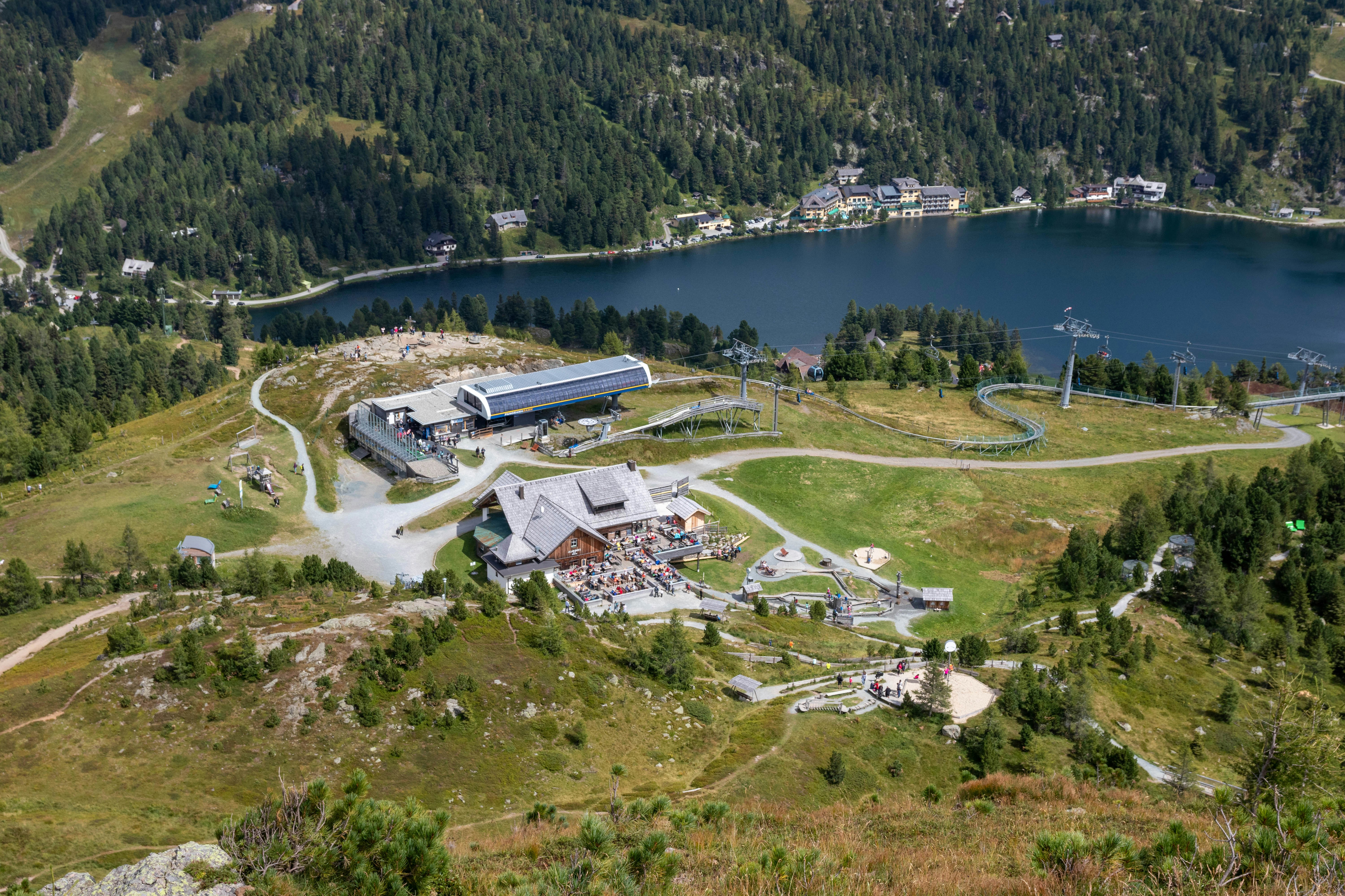 an aerial view of a large building in the middle of a forest