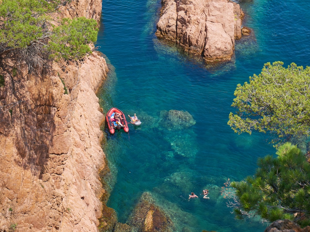 a couple of boats floating on top of a body of water