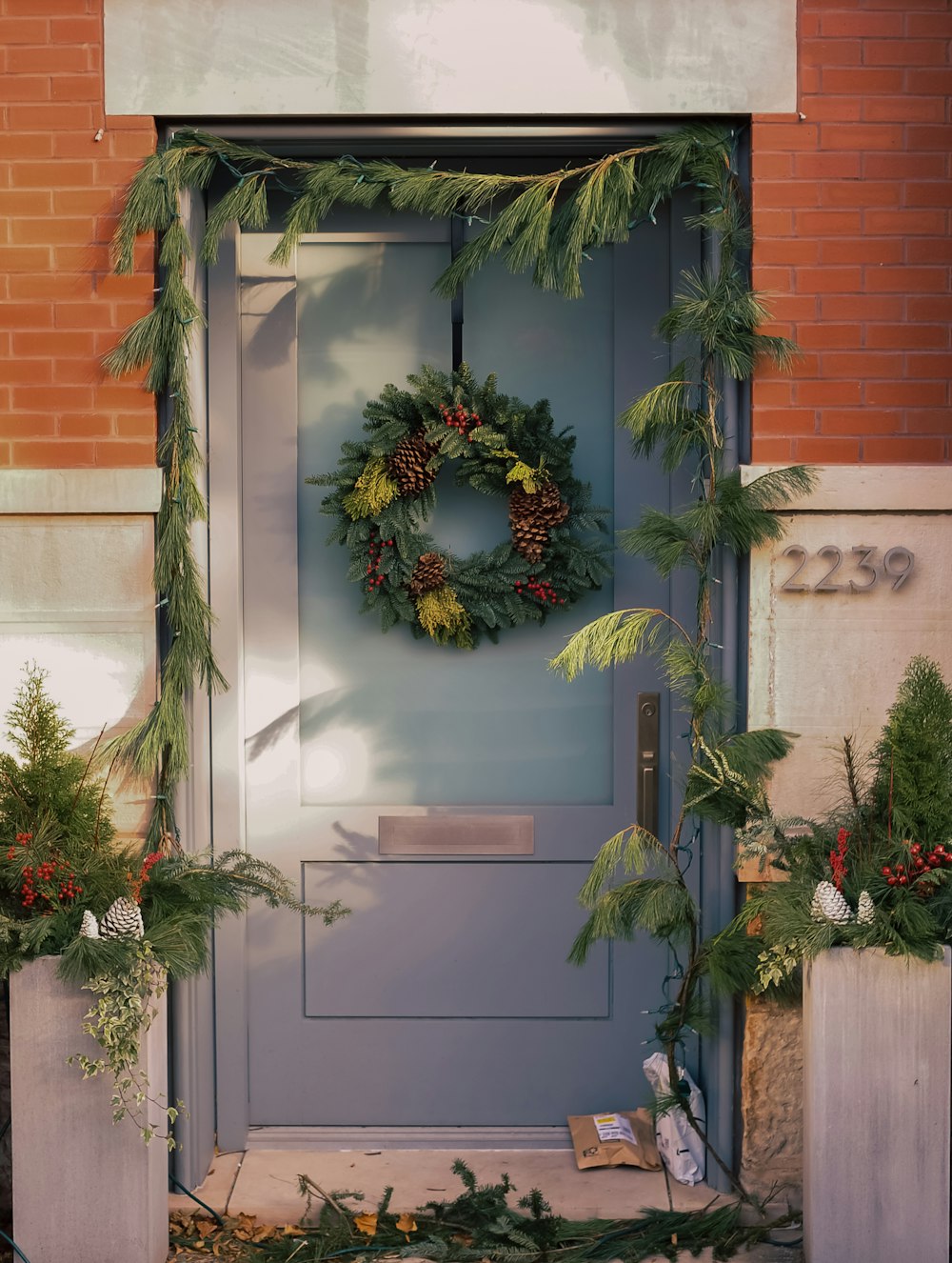 a blue door with a wreath on it