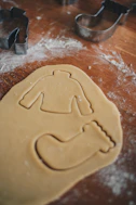 a cookie cutter and cookie dough with a star wars character on it