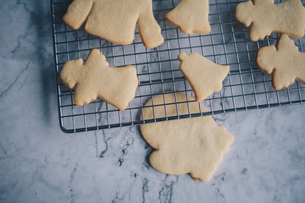 a cooling rack filled with cookies on top of a counter