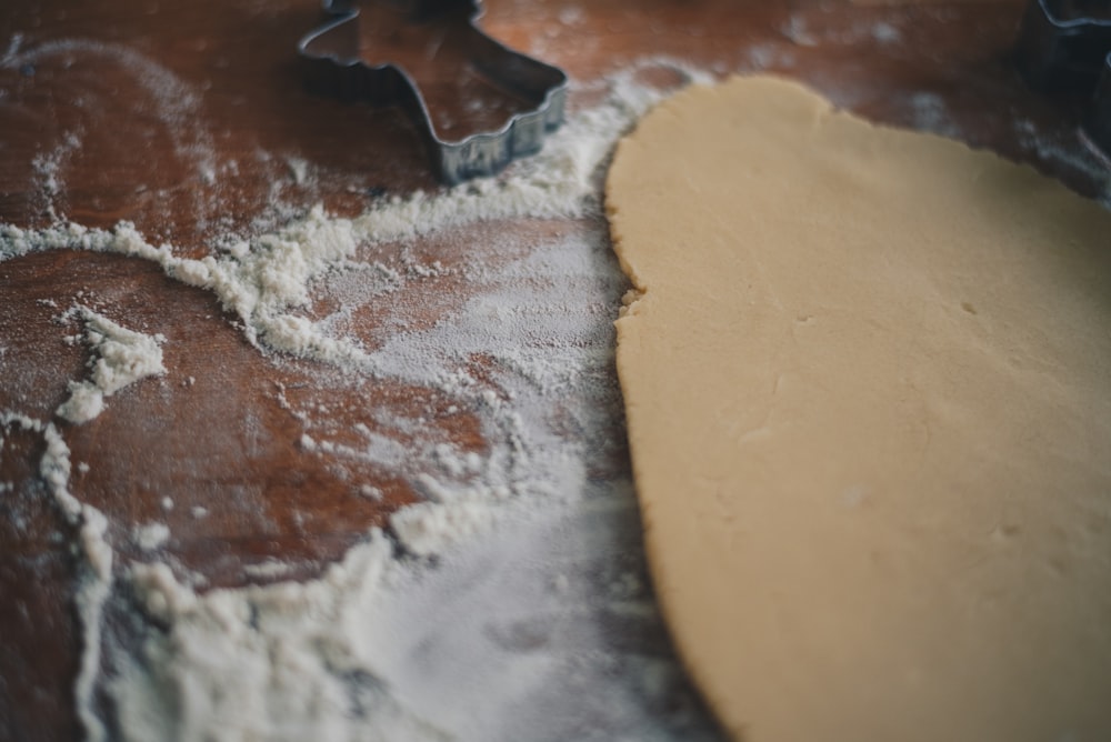 a cookie dough with a cookie cutter next to it