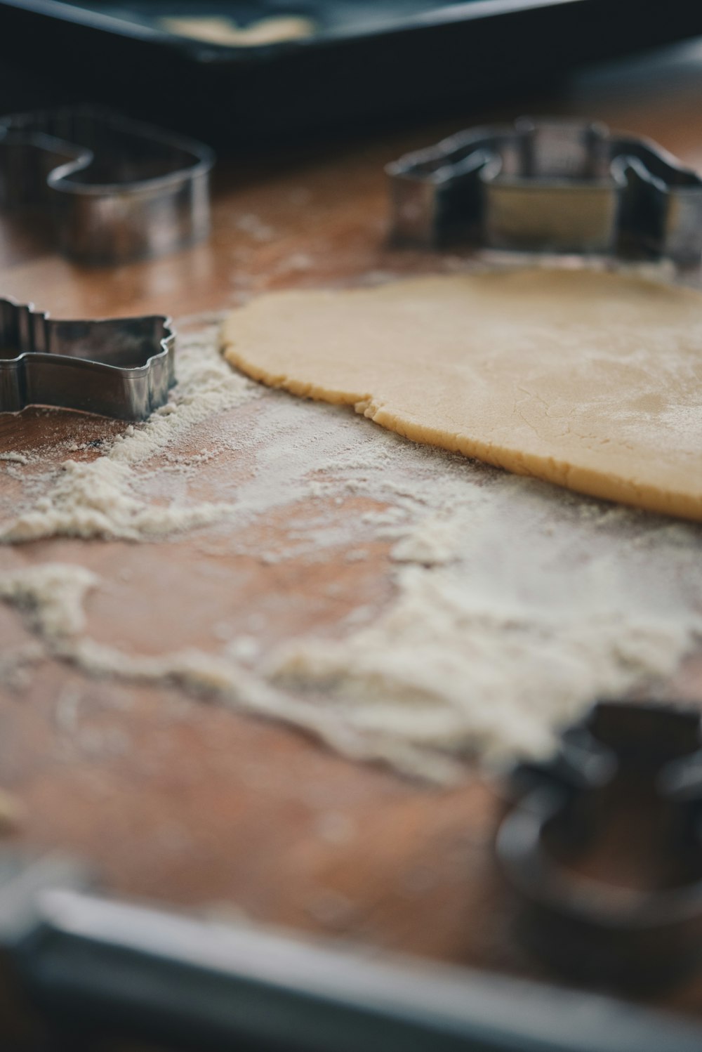 a cookie cutter and cookie dough on a table