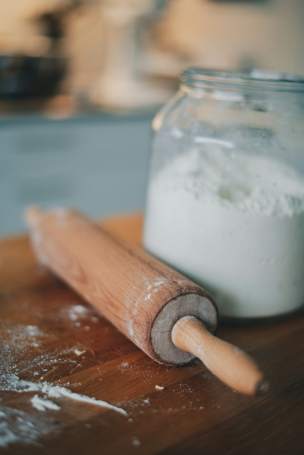 a wooden rolling pin sitting on top of a wooden table