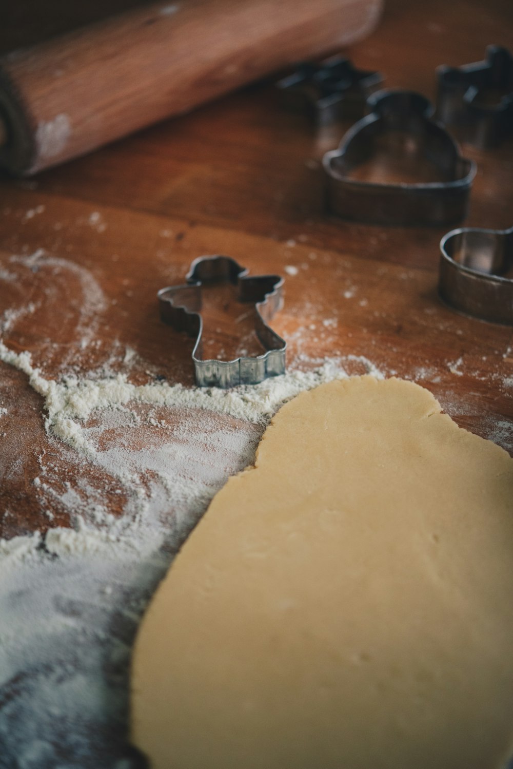 a cookie cutter and dough on a table