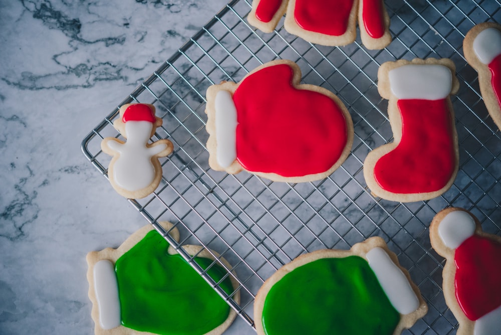 decorated christmas cookies on a cooling rack