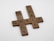 Scrabble tiles are arranged to form the words mercy, grace, and peace in a crossword pattern on a plain white background.