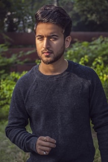 Stylish man with a full hair patch posing outdoors