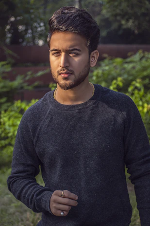 A before photo of a man standing outdoors with a serious expression prior to vidaleve lifestyle change