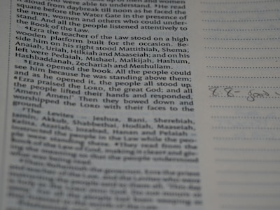 A proofreader marking corrections on a printed document.