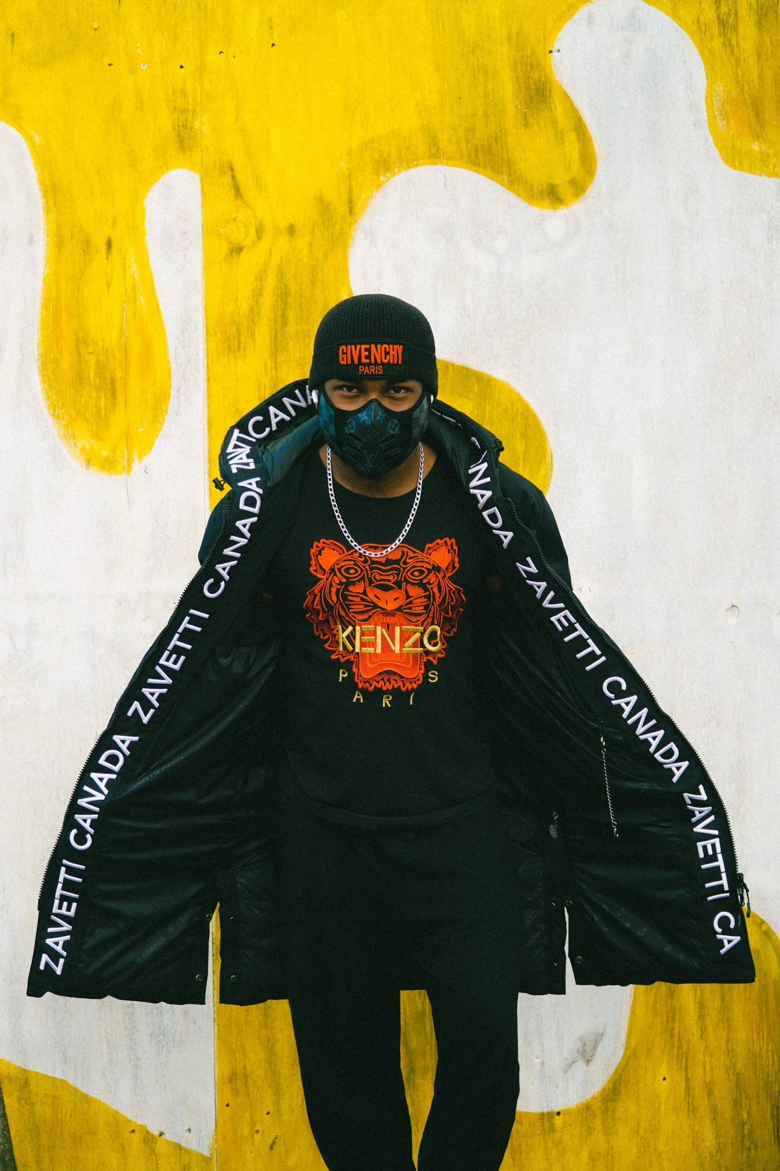 Streetwear model in a black jacket photographed in the city