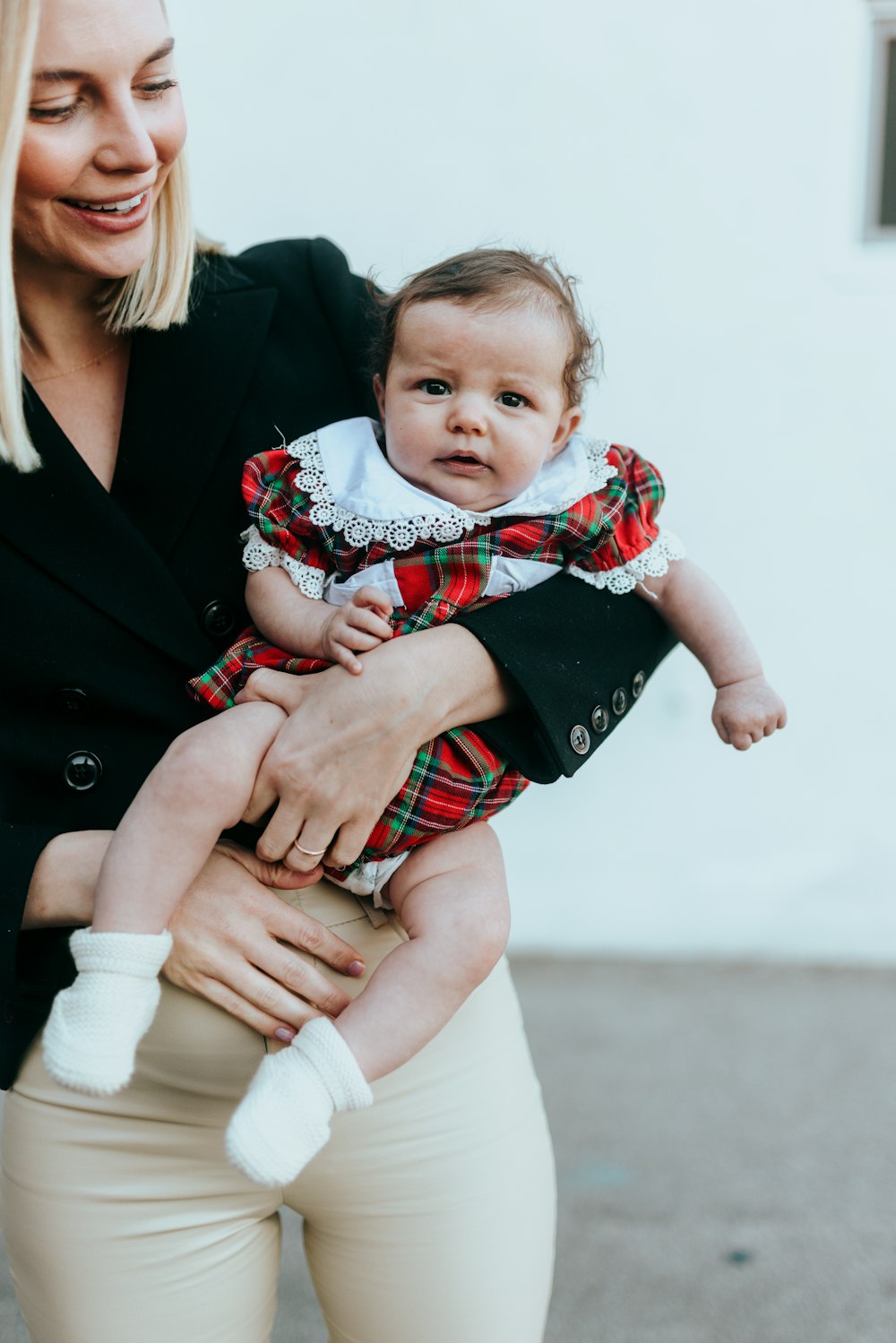 a woman holding a baby in her arms