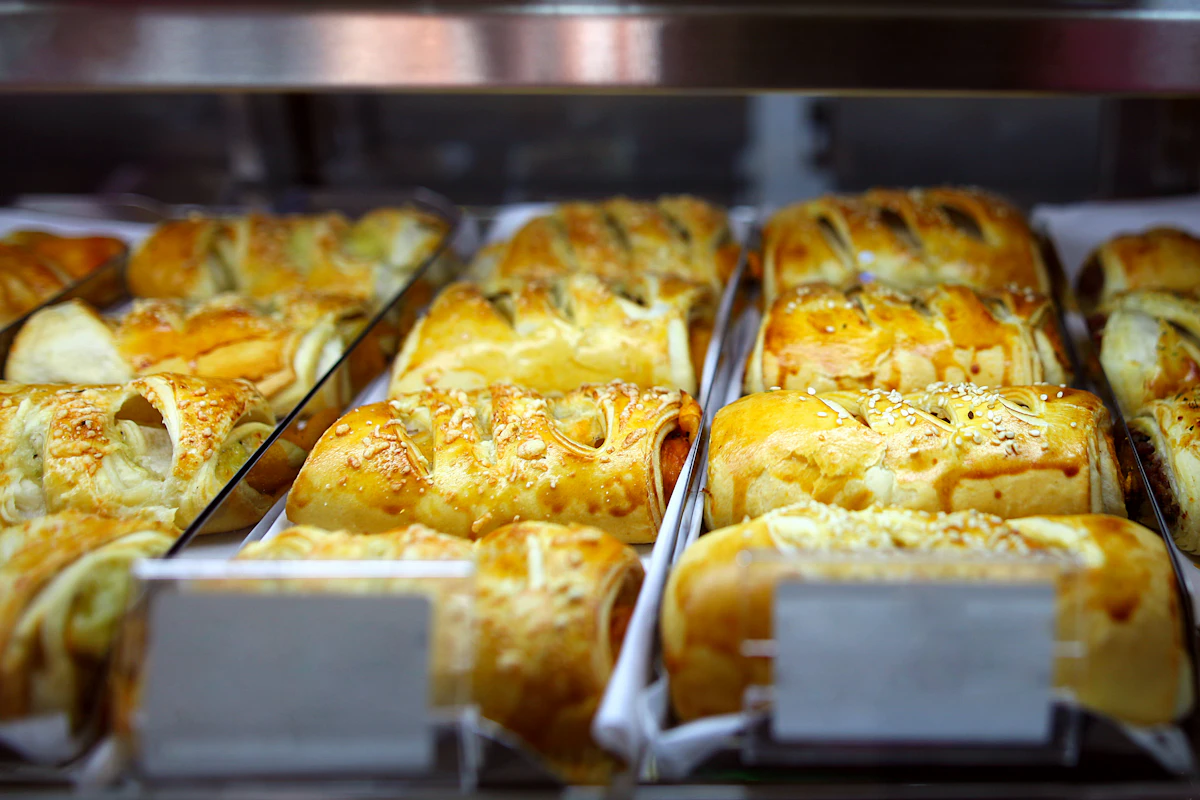 A display of baked goods in a bakery case