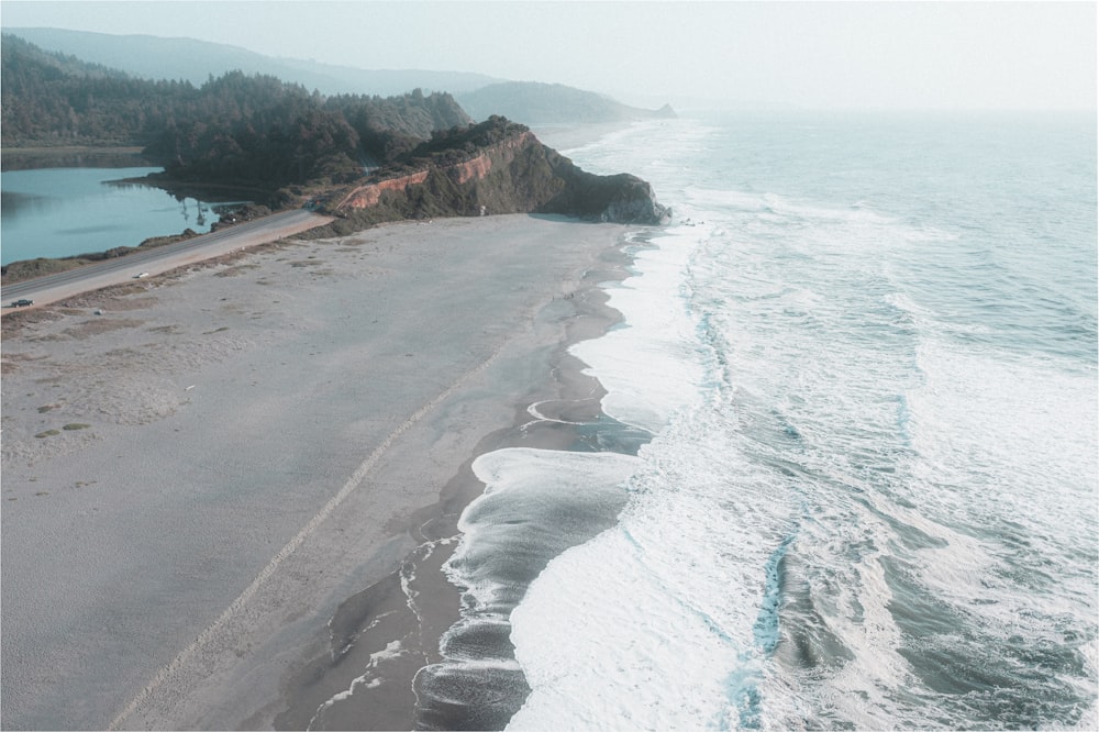 an aerial view of a beach and a body of water