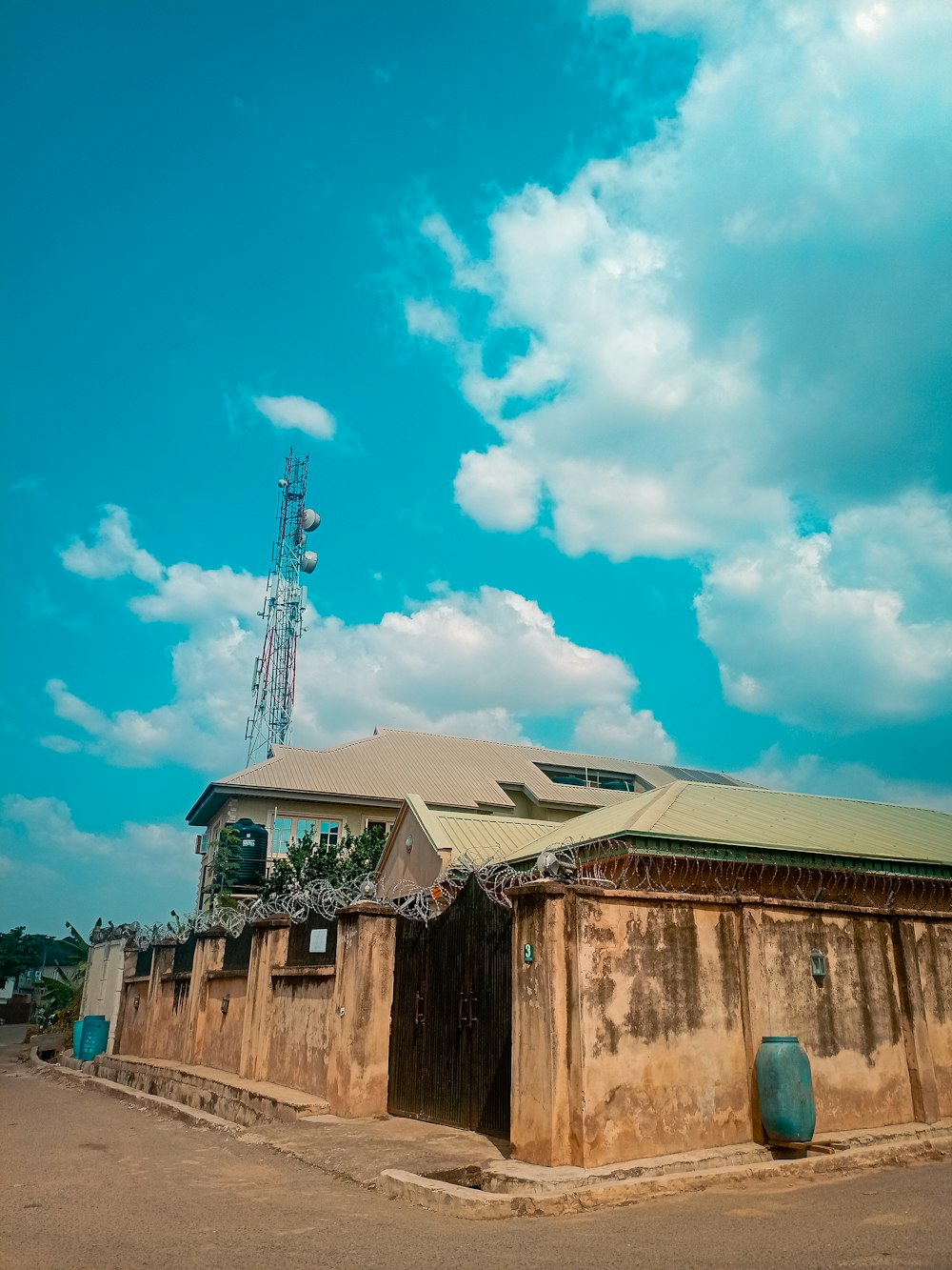 a building with a cell phone tower in the background