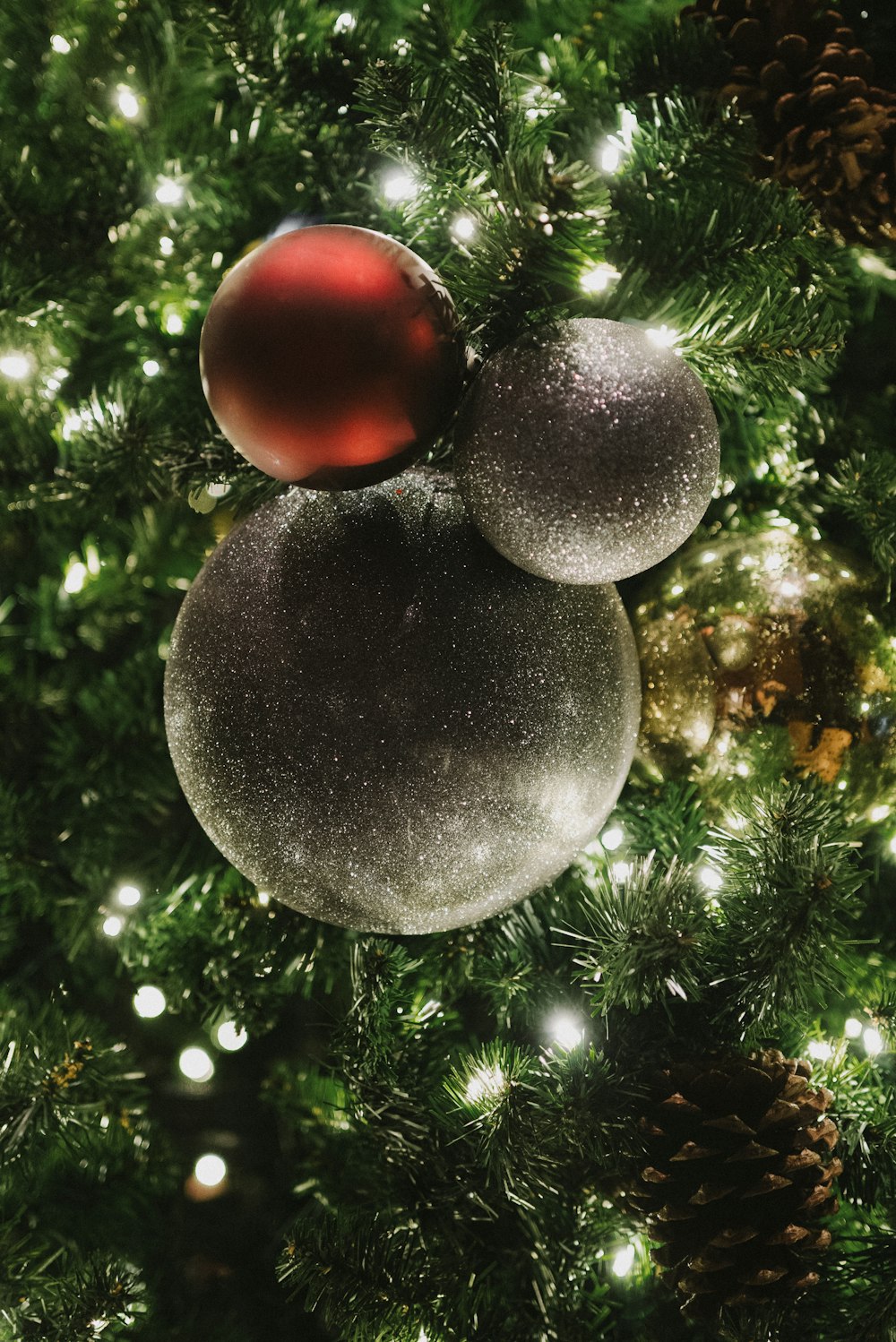 a close up of two ornaments on a christmas tree