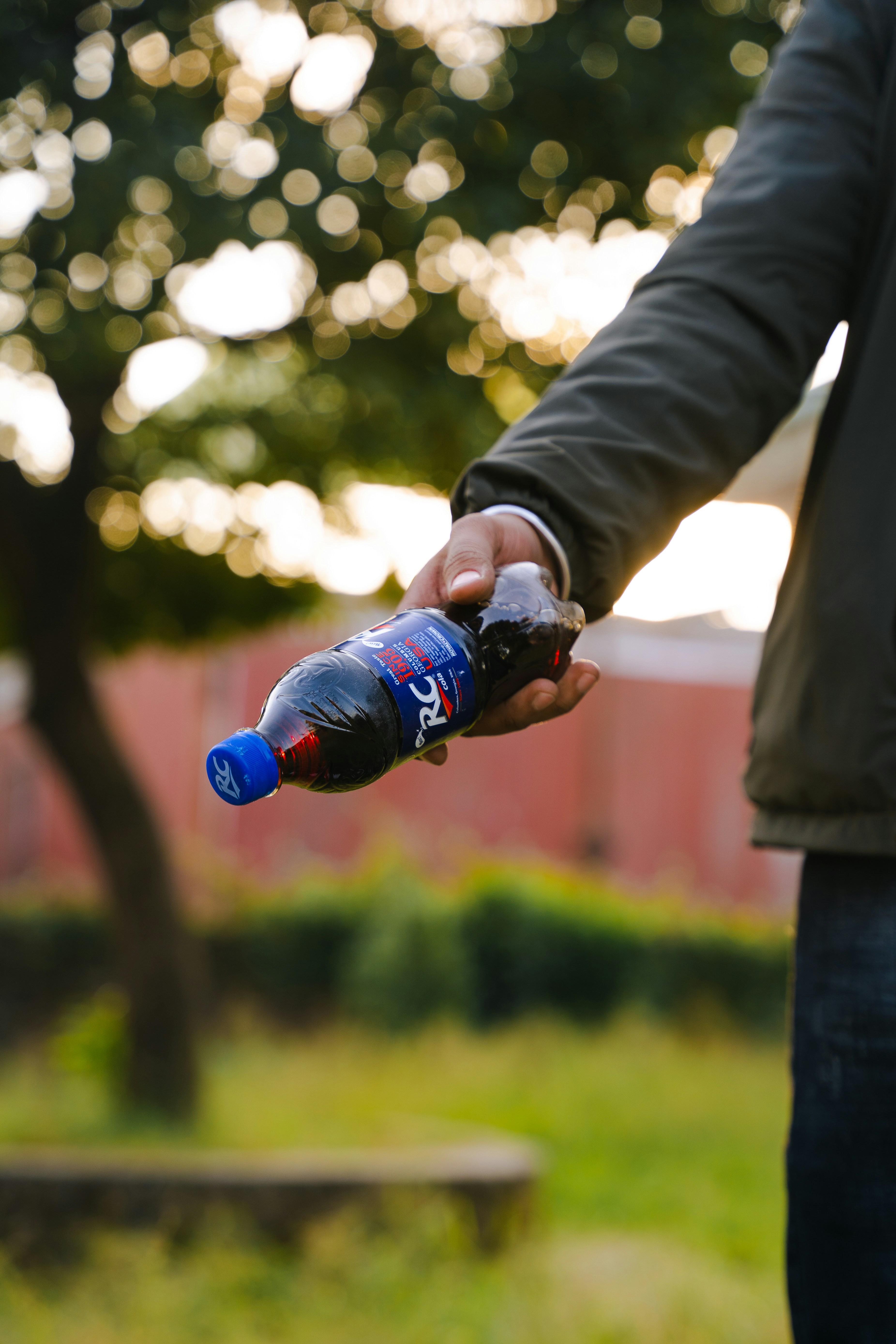 a man holding a bottle of water in his hand