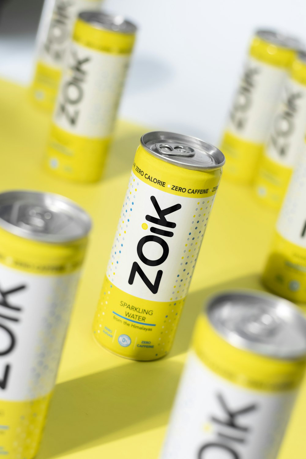 a group of cans of soda sitting on top of a table