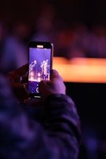 a hand holding a cellphone