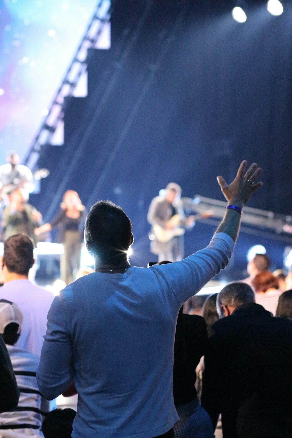 a group of people standing on top of a stage