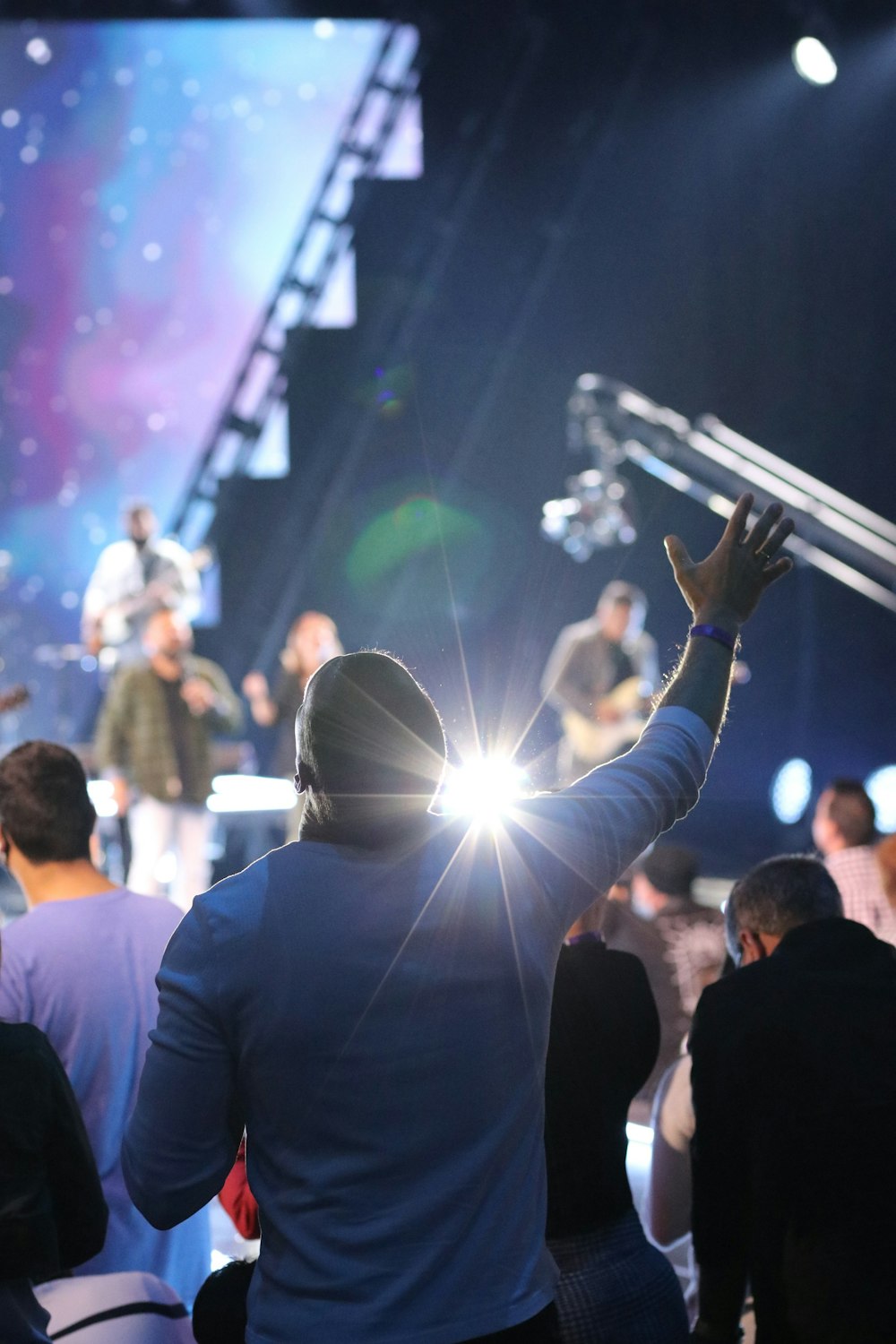 a man standing in front of a crowd of people