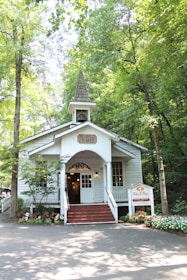 A peaceful chapel nestled in a green landscape, inviting visitors to reflect.