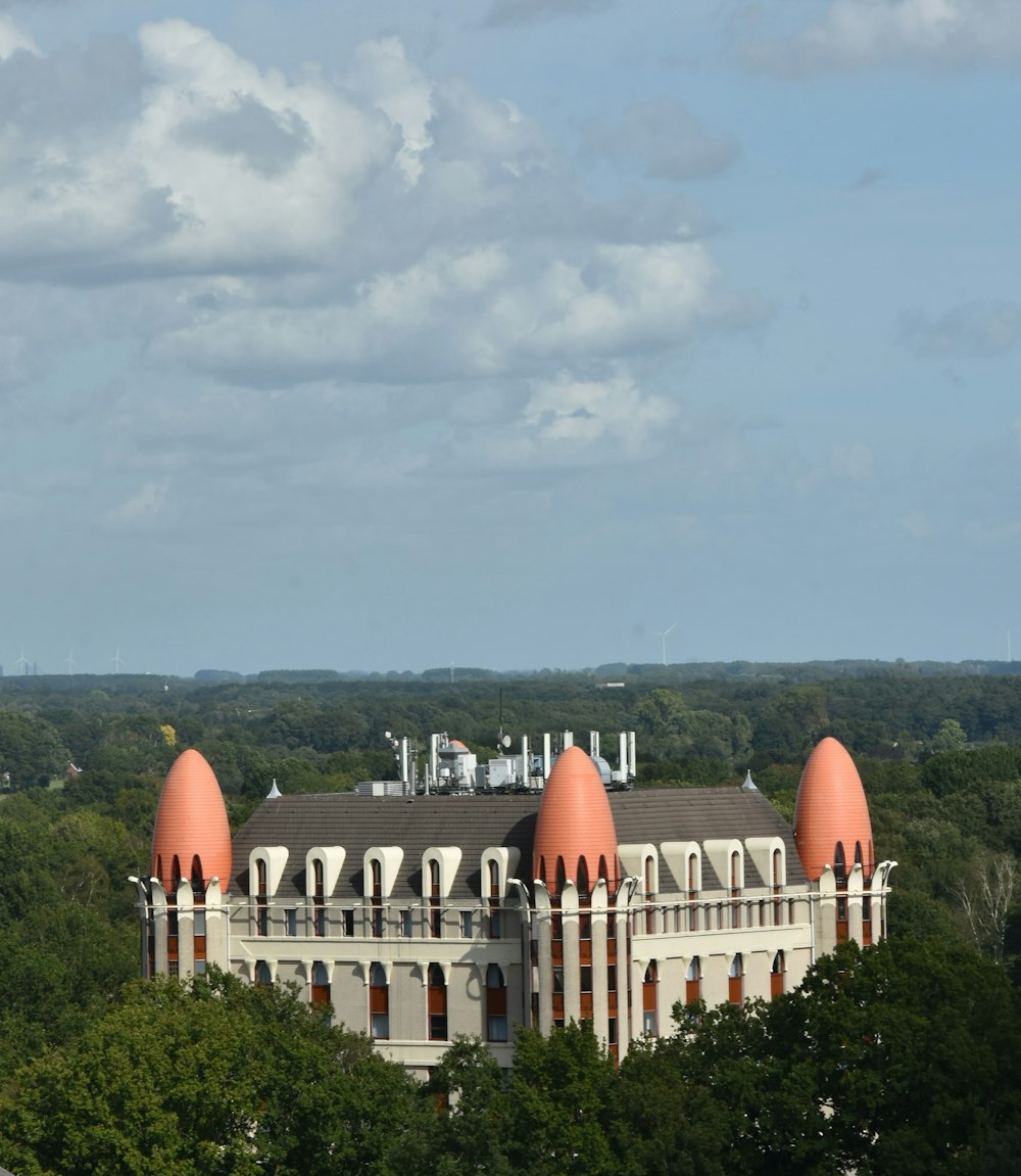a large building with orange domes on top of it