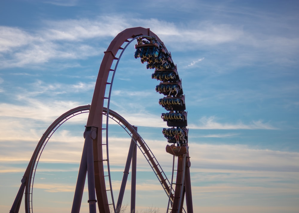 a roller coaster in the middle of a park