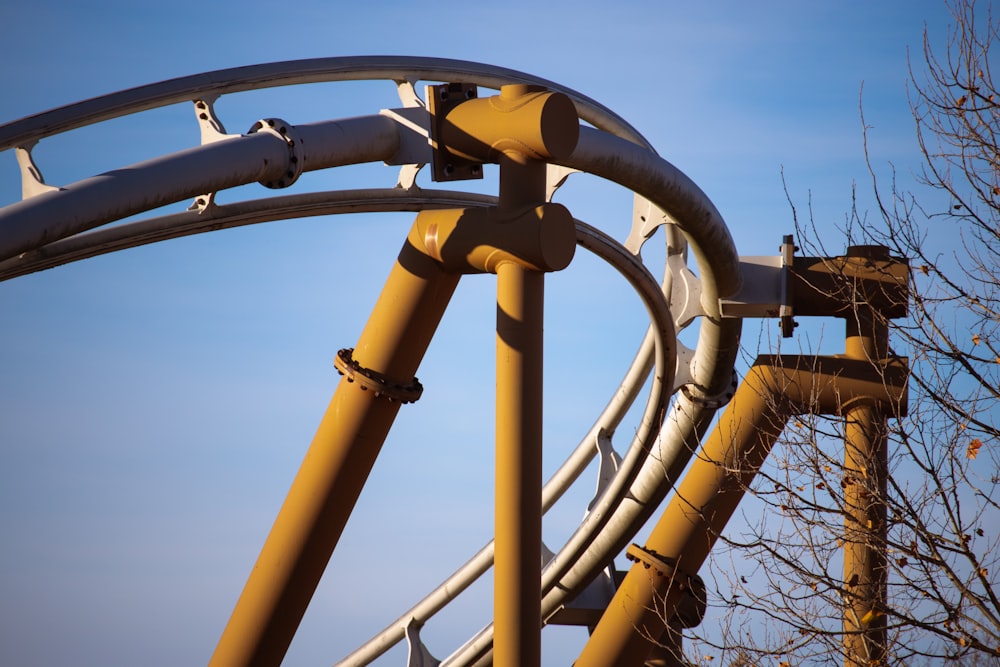 a close up of a roller coaster at a theme park