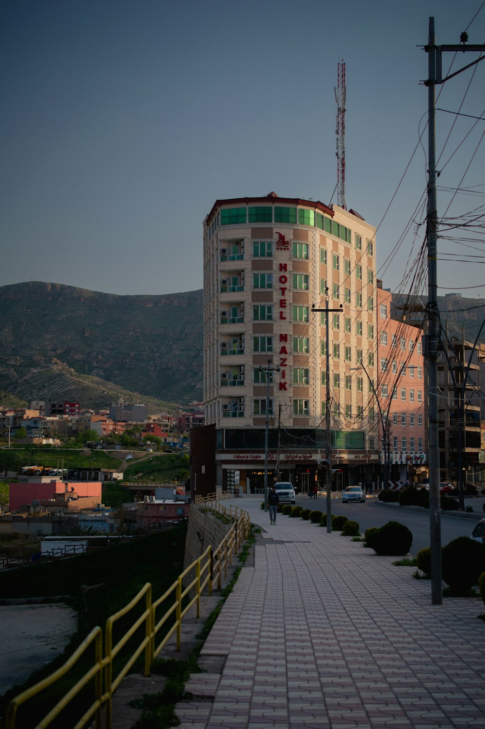 a tall building sitting on the side of a road