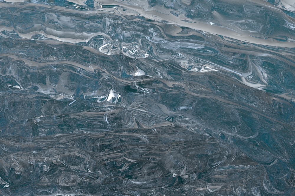 a close up of a blue and silver surface