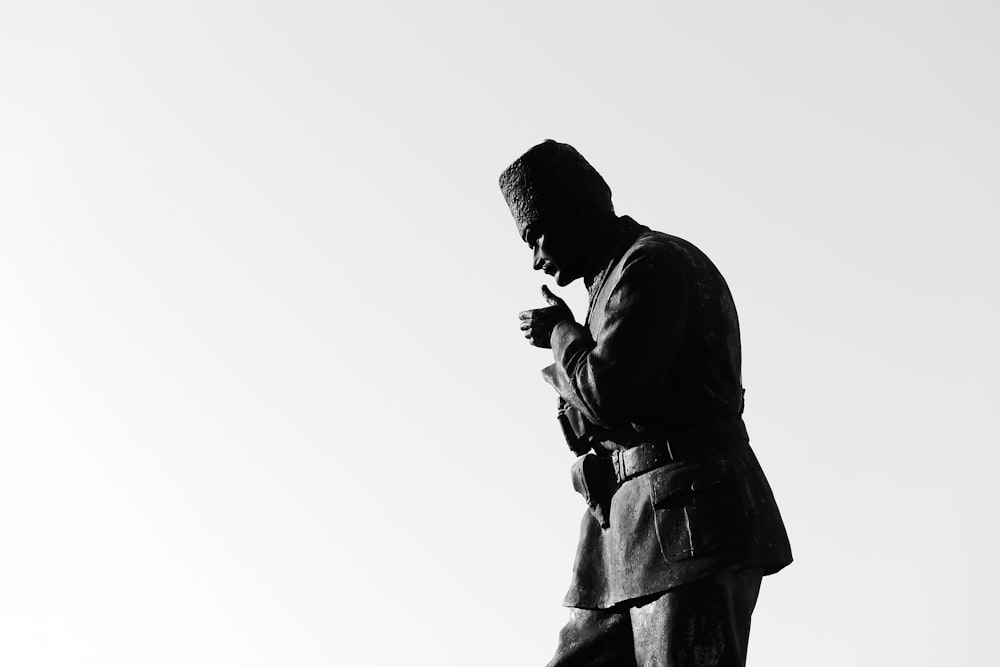 a black and white photo of a man in a suit