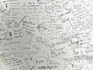 a white wall with many writing on it