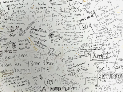 a white wall with many writing on it