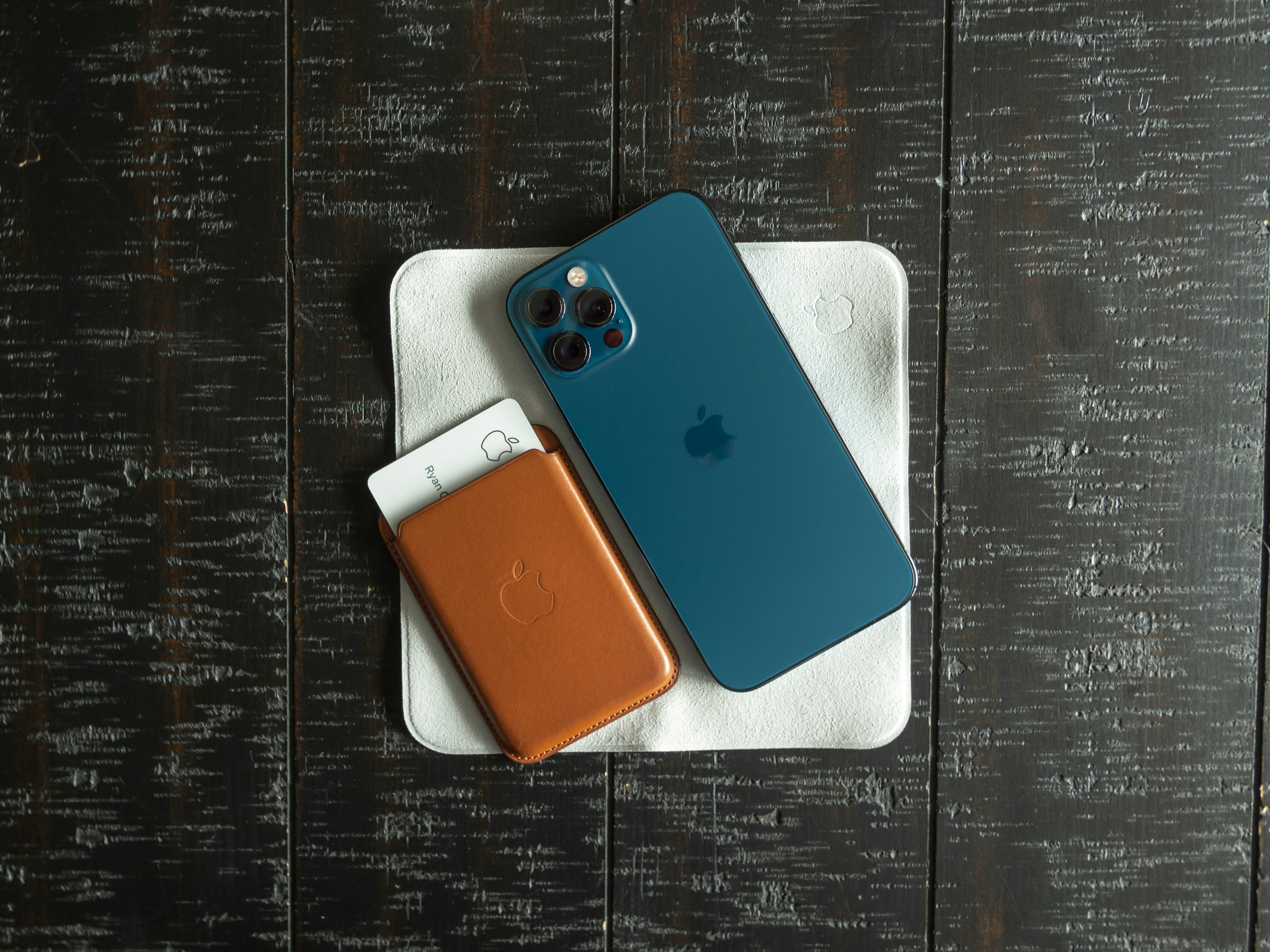 a couple of cell phones sitting on top of a table