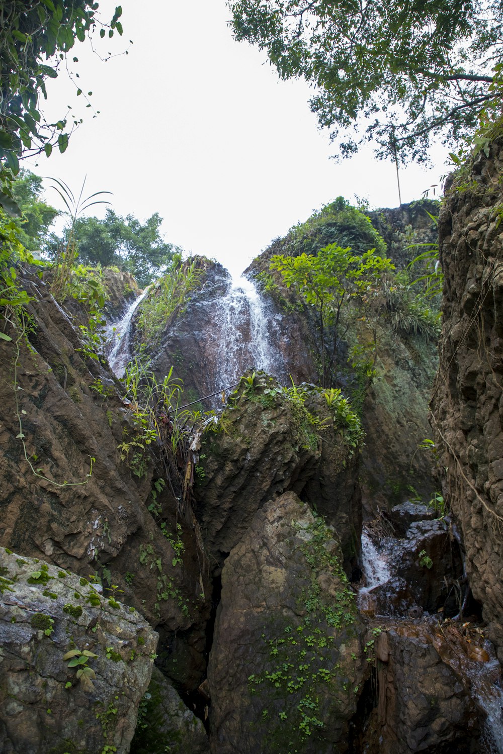 a waterfall in the middle of a rocky area