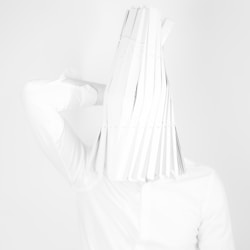 a woman in a white shirt is covering her face with her hands