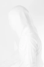 a person in a white jacket with a hood up