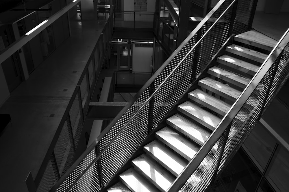 a black and white photo of a stair case