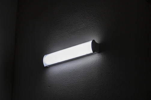 Close-up of a wall washer LED fixture installed in a modern office space.