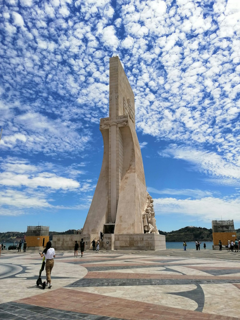 a person riding a skateboard in front of a monument