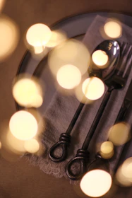 Warm, inviting shot of a catered event with guests enjoying freshly prepared dishes under soft lighting.