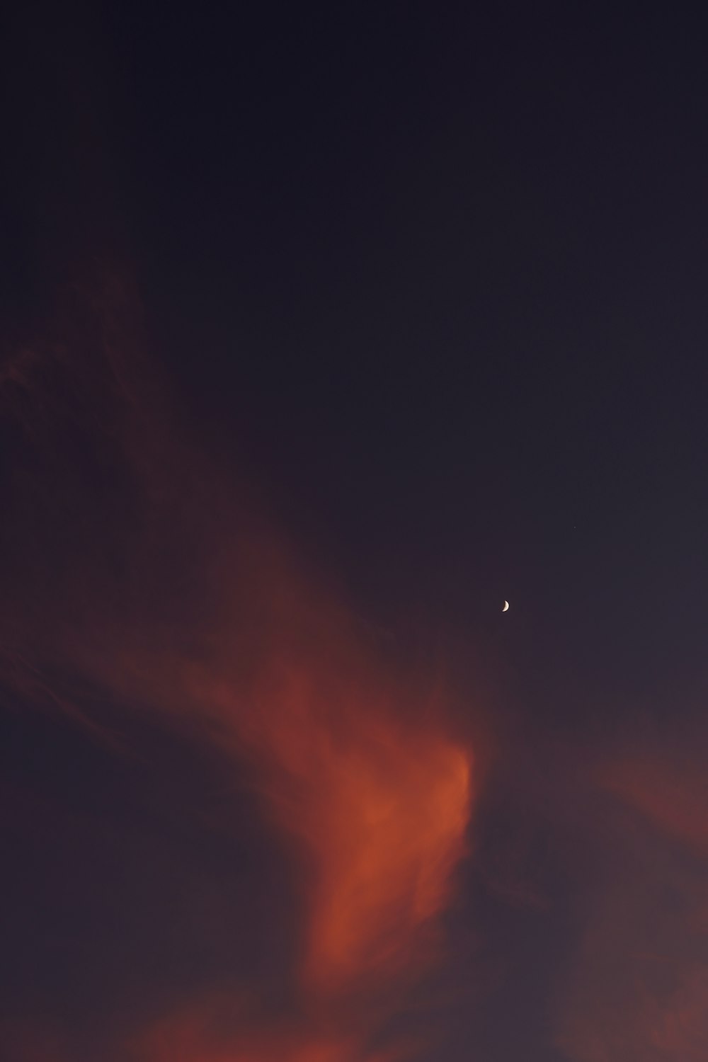 a plane flying in the sky at night