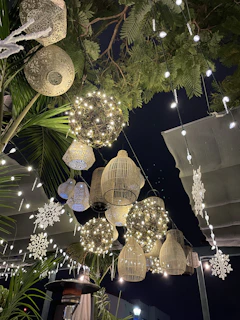 A cozy winter wonderland birthday setup with snowflake decorations and warm, glowing lanterns