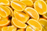 A close-up of juicy oranges freshly picked and arranged neatly.