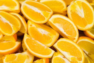 A collection of fresh, juicy orange slices arranged closely together, showcasing their vibrant color and texture.