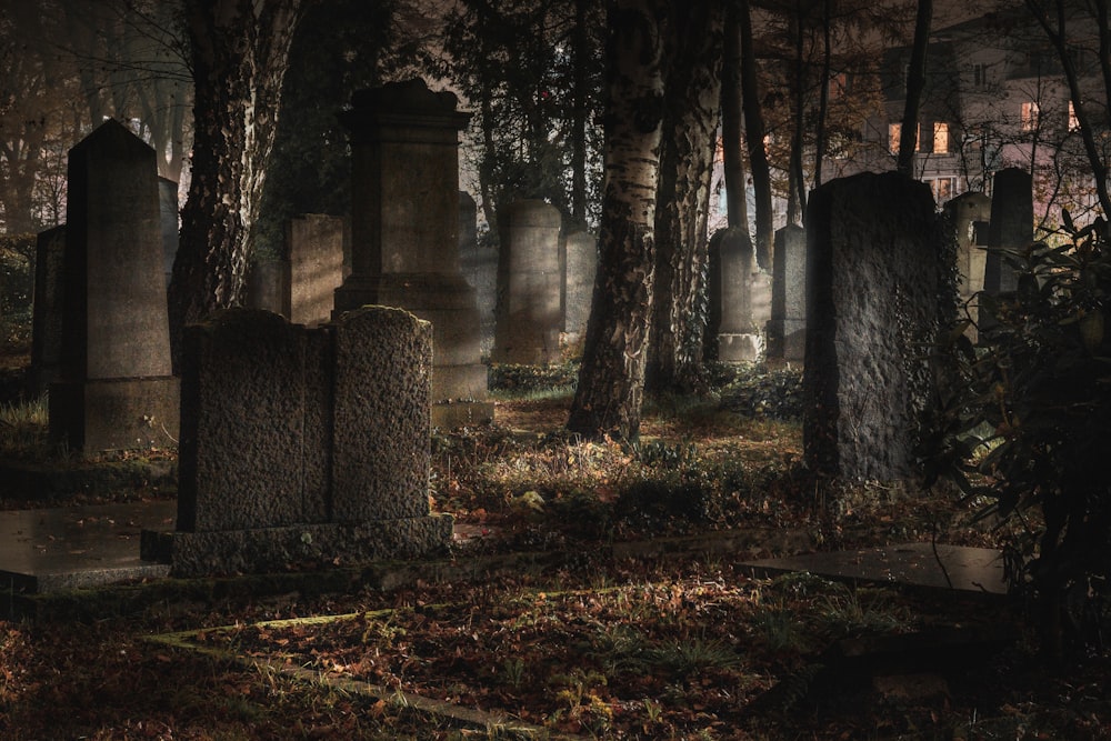 a cemetery at night with the lights on