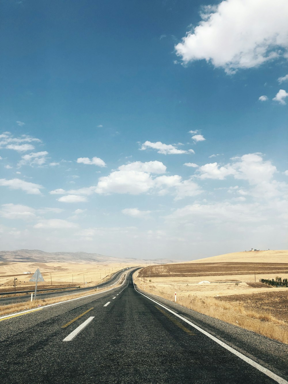 an empty road in the middle of nowhere